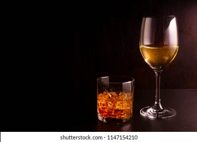 wine-whiskey-on-black-background-260nw-1147154210